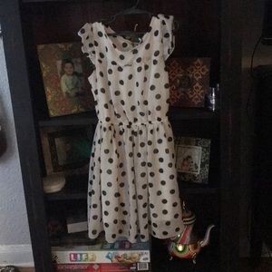 A white dress with black polka dots